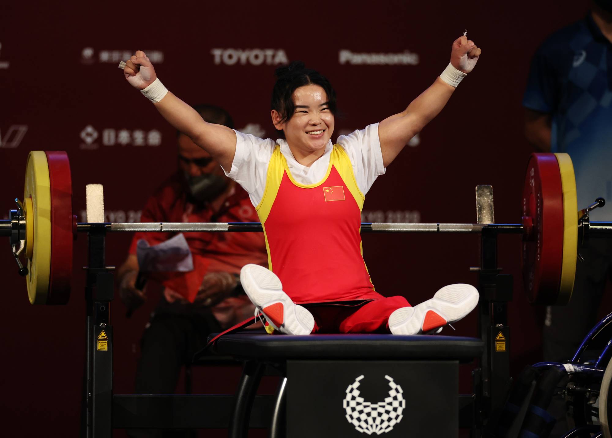 Lingling Guo of China celebrates during the final of the women's under-41 kg powerlifting final | REUTERS