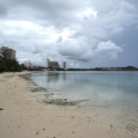 A mostly empty beach at Tumon Bay, Guam, on Aug. 21. Guam once welcomed 1.7 million visitors a year. That number has fallen to a tiny trickle.  | ANTHONY HENRI OFTANA / THE NEW YORK TIMES