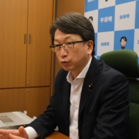 Masaaki Taira, former state minister of Cabinet Office in charge of information technology policy, speaks during an interview in August in Tokyo. | KAZUAKI NAGATA 

