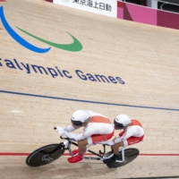Poland\'s Marcin Polak (R) and Michal Ladosz compete during the Tokyo 2020 Paralympic Games on August 25, 2021. Polak later tested positive for the banned blood booster EPO (erythropoietin). | AFP-JIJI