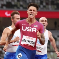 Nick Mayhugh of the United States reacts after winning gold and setting a new world record in the men\'s T37 100 meters. | REUTERS