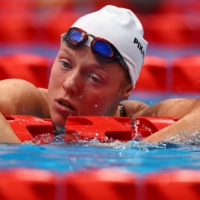 Viktoriia Ishchiulova of the Russian Paralympic Committee reacts after being disqualified from the women\'s S8 100-meter backstroke. | REUTERS