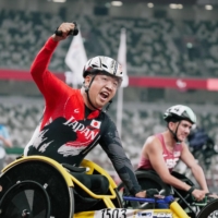 Tomoki Sato reacts after winning the men\'s T52 400-meter final during he Tokyo Paralympics at National Stadium on Friday.  | KYODO