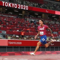 Nick Mayhugh of the United States reacts after winning gold and setting a new world record.  | REUTERS