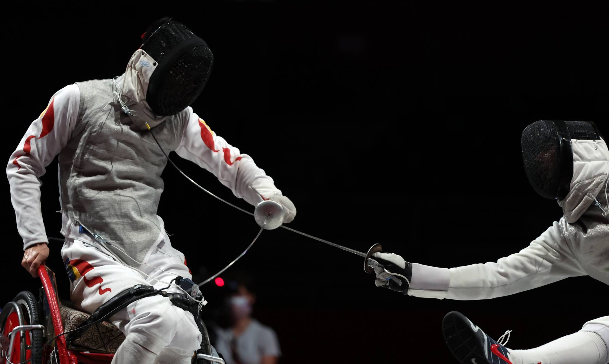 China's Gang Sun in action against Hungary's Richard Osvath during the men's foil individual event of wheelchair fencing | REUTERS