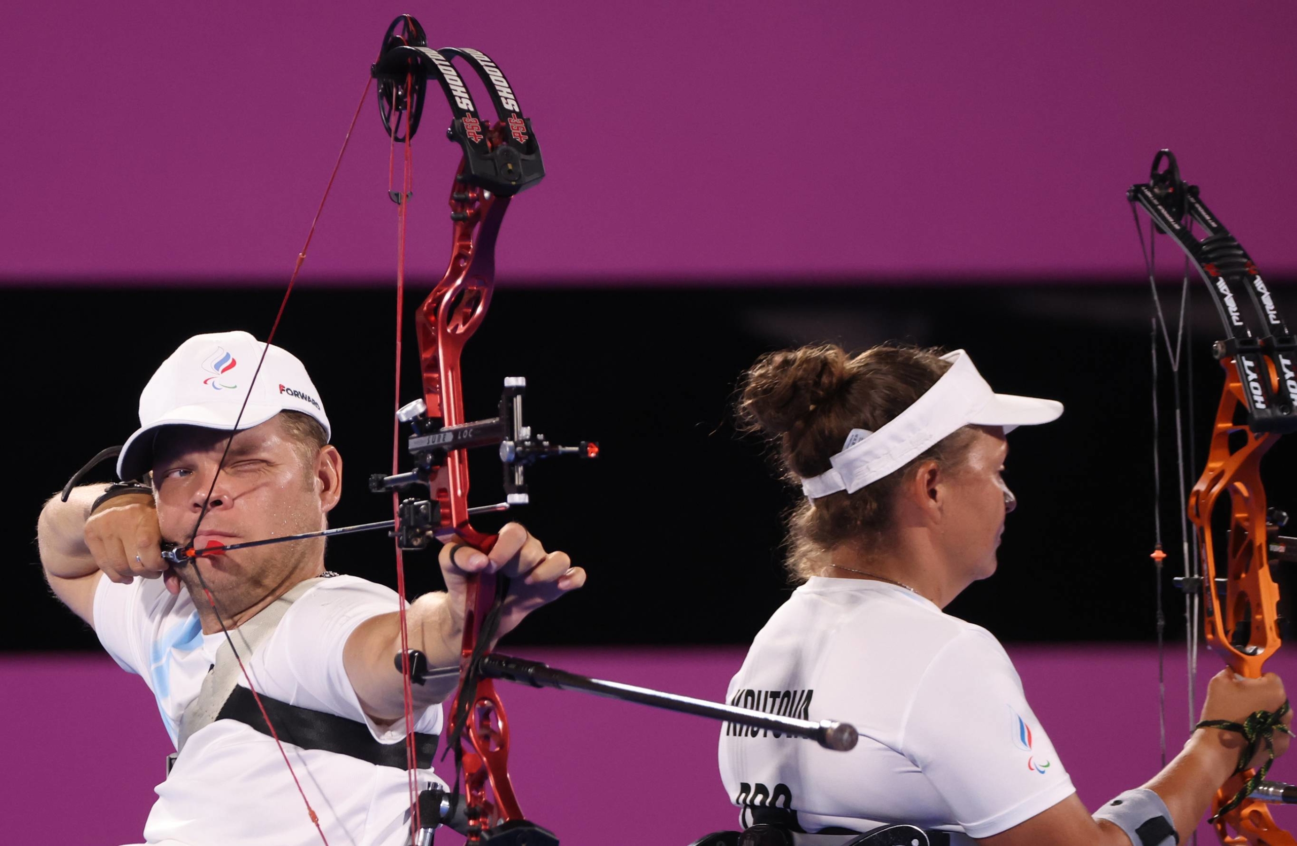 Russian Paralympic Committee's Aleksei Leonov and Elena Krutova compete during the mixed team W1 archery quarterfinals against China. | REUTERS