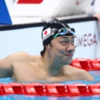 Naohide Yamaguchi of Japan reacts after winning gold and setting a world record at Tokyo Aquatics Centre.  | REUTERS