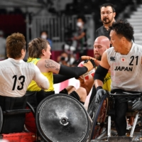 Japan and Australia battle for the ball in the second period on Sunday.  | DAN ORLOWITZ 
