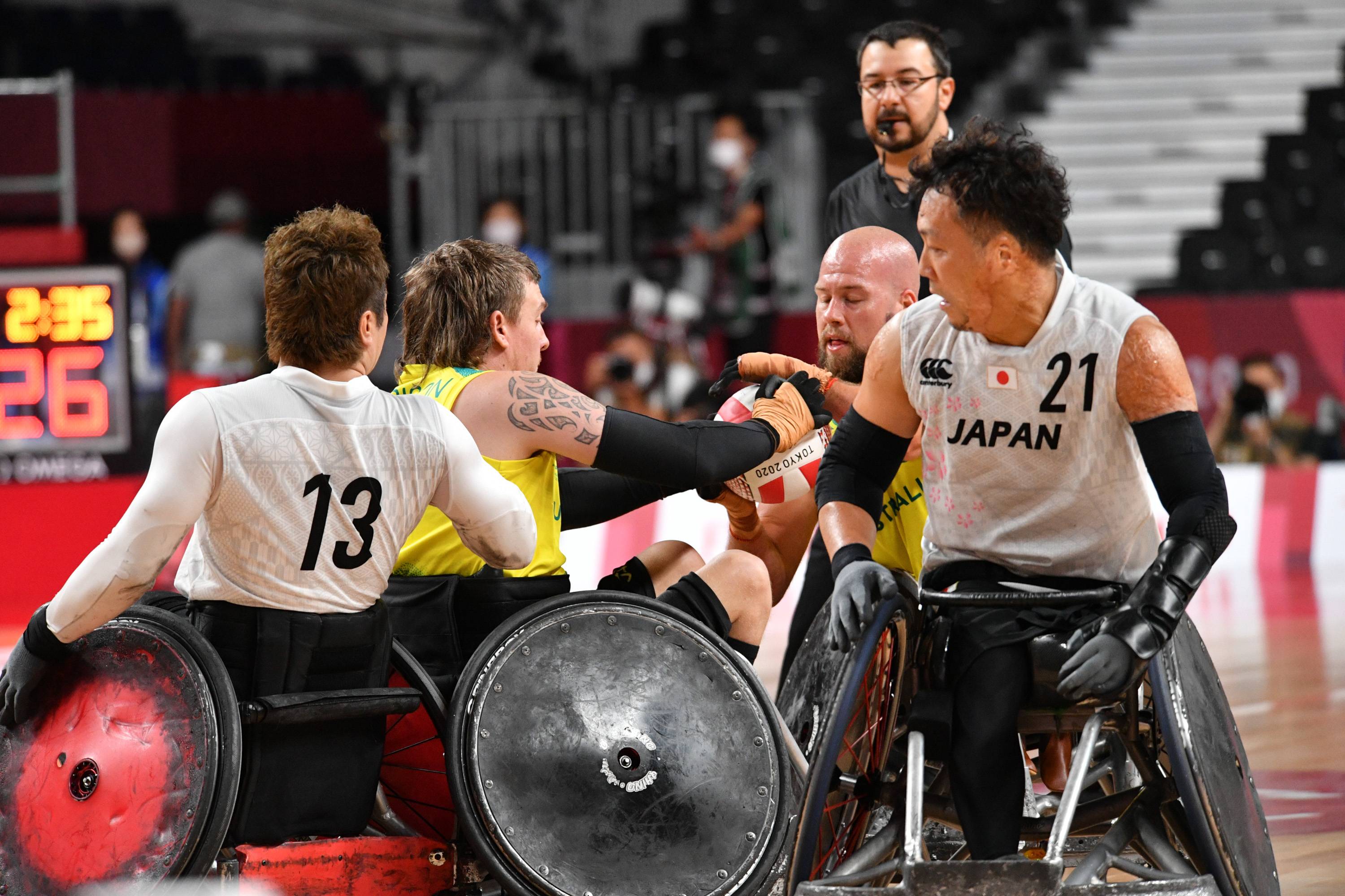 Japan and Australia battle for the ball in the second period on Sunday.  | Dan Orlowitz 
