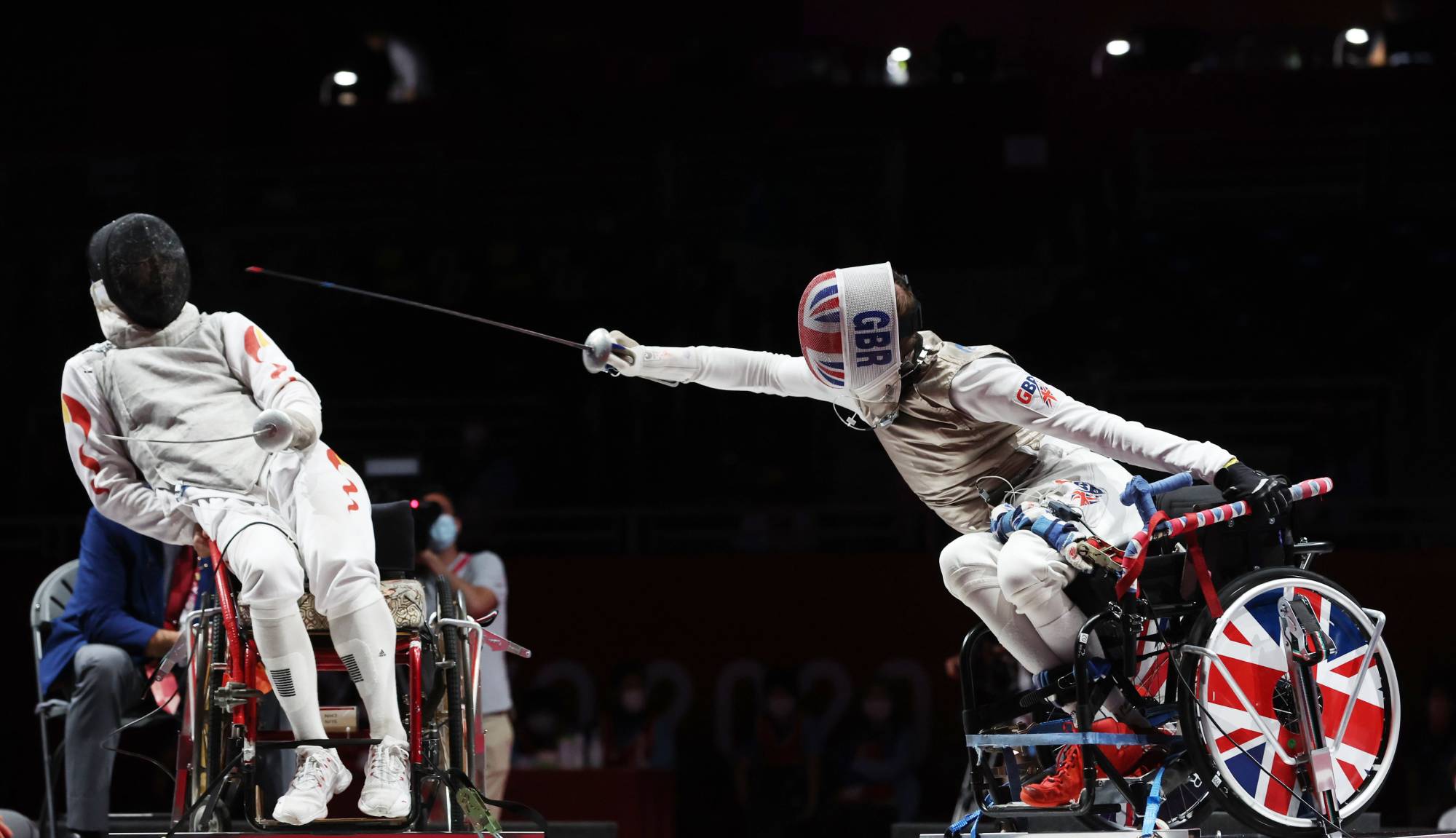 Ching's Gang Sun and Britain's Piers Gilliver during the men's foil team final of wheelchair fencing. | OIS