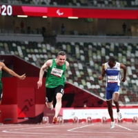 Ireland\'s Jason Smyth crosses the finish line first to win gold in the men\'s T13 100 meter. | REUTERS