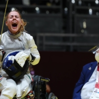 Hungary\'s Eva Andrea Hajmasi reacts after winning the bronze medal bout againts Hong Kong\'s Chui Yee Yu in the women\'s foil team wheelchair fencing. | REUTERS