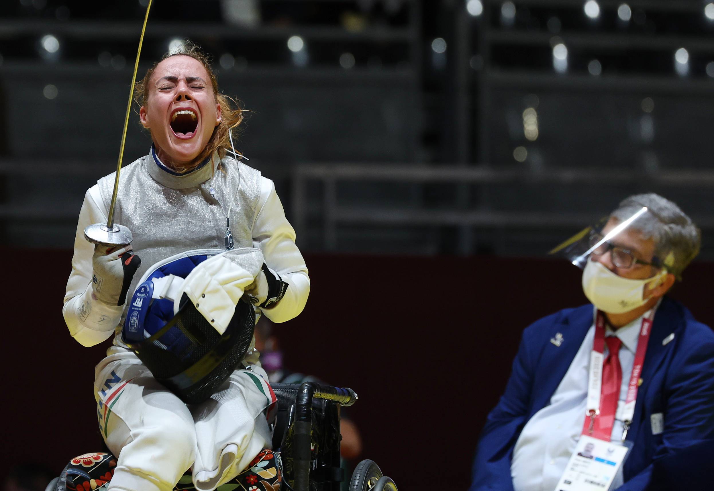 Hungary's Eva Andrea Hajmasi reacts after winning the bronze medal bout againts Hong Kong's Chui Yee Yu in the women's foil team wheelchair fencing. | REUTERS