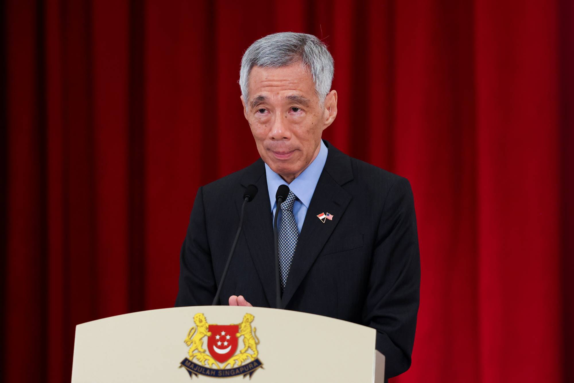 Singapore Prime Minister Lee Hsien Loong gives a policy speech during a national day rally Sunday night. | REUTERS 