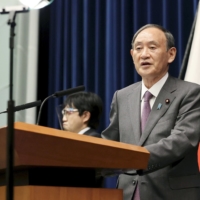 Prime Minister Yoshihide Suga speaks during a news conference at the Prime Minister\'s Office on Wednesday. | POOL / VIA KYODO