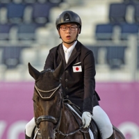 Soshi Yoshigoe and his horse Hashtag compete in the equestrian Dressage Individual Test Grade II event at the Tokyo Paralympics on Thursday. | KYODO