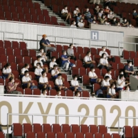 Students watch a goalball event during the Tokyo Paralympics on Wednesday in the city of Chiba. | KYODO
