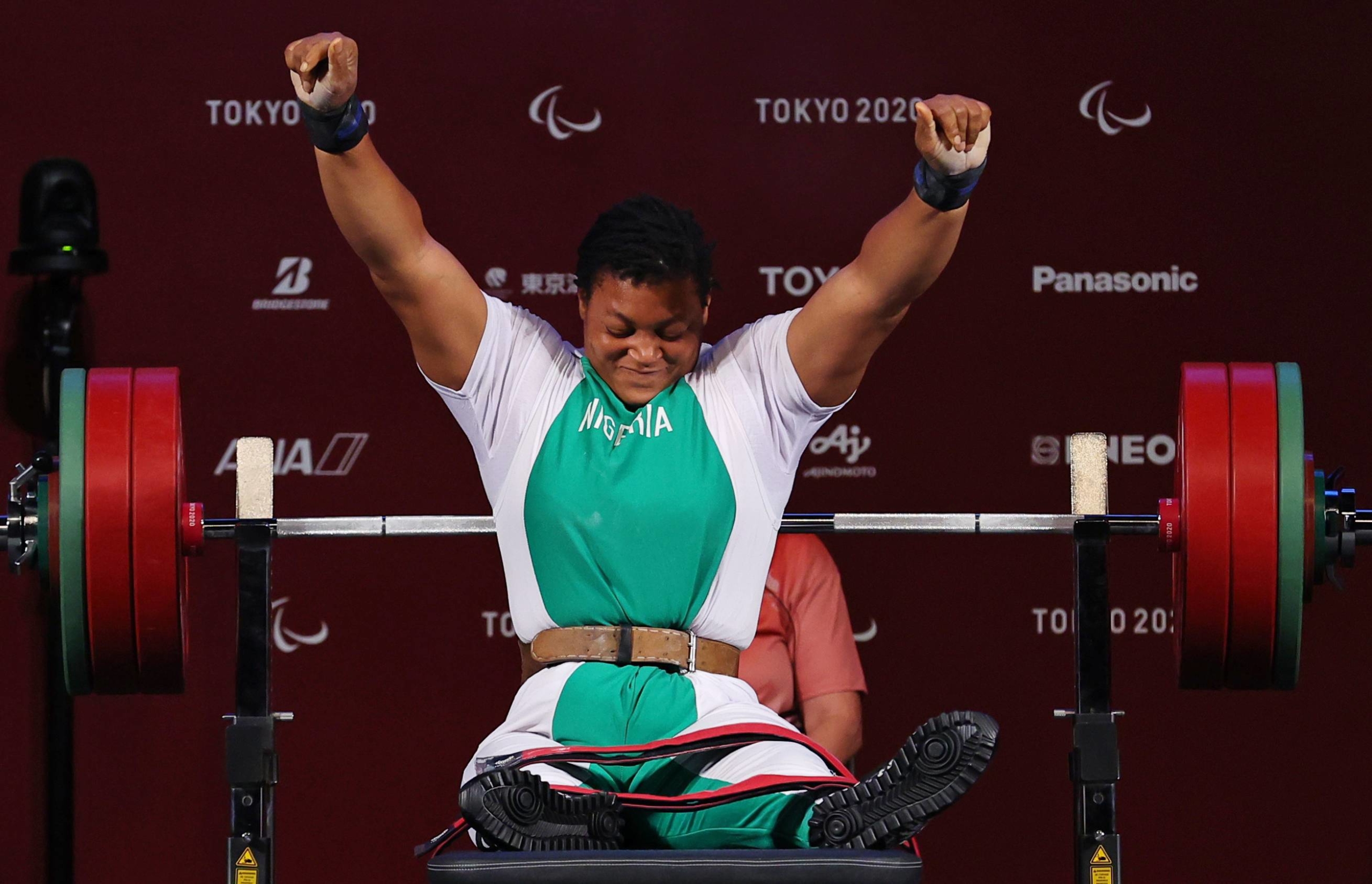 Nigeria's Folashade Oluwafemiayo reacts after a clean lift in the women's under-86 kg powerlifting final. | REUTERS