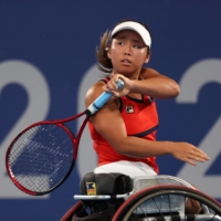 Japan\'s Yui Kamiji in action against Brazil\'s Meirycoll Duval during the second round of women\'s singles wheelchair tennis. | REUTERS