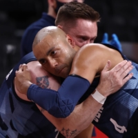 Britain\'s Terry Bywater and Gaz Choudhry embrace after beating Australia in the preliminary round group B of men\'s wheelchair basketball. | REUTERS