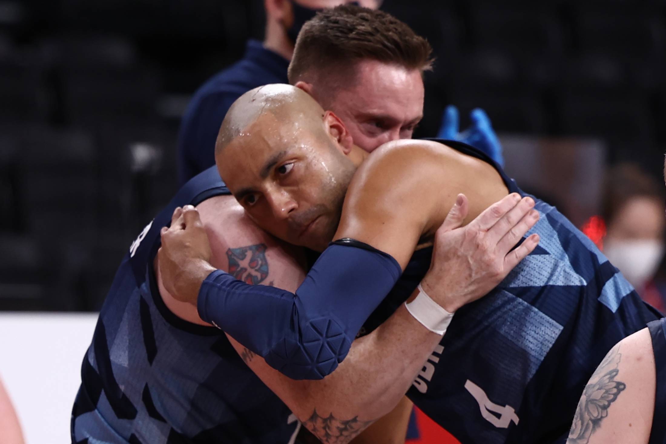 Britain's Terry Bywater and Gaz Choudhry embrace after beating Australia in the preliminary round group B of men's wheelchair basketball. | REUTERS