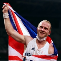 British sprinter Jonnie Peacock celebrates after winning bronze in the men\'s T64 100-meter final at the 20202 Tokyo Paralympics on Monday. | REUTERS