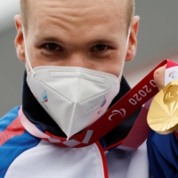 Gold medalist Mikhail Astashov of the Russian Paralympic Committee celebrates at the medal ceremony of the men\'s C1 cycling road time trial | REUTERS