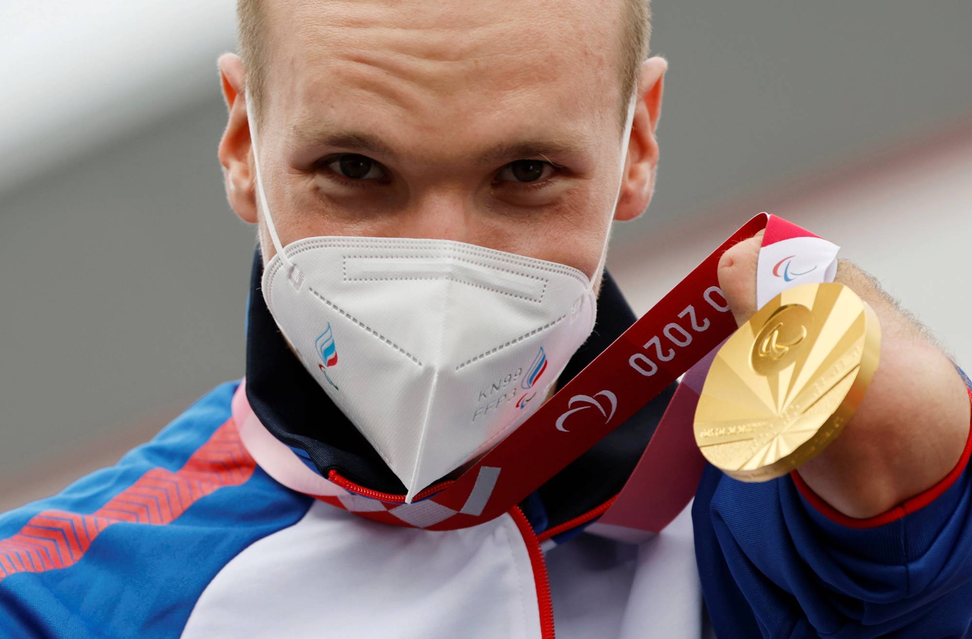 Gold medalist Mikhail Astashov of the Russian Paralympic Committee celebrates at the medal ceremony of the men's C1 cycling road time trial | REUTERS