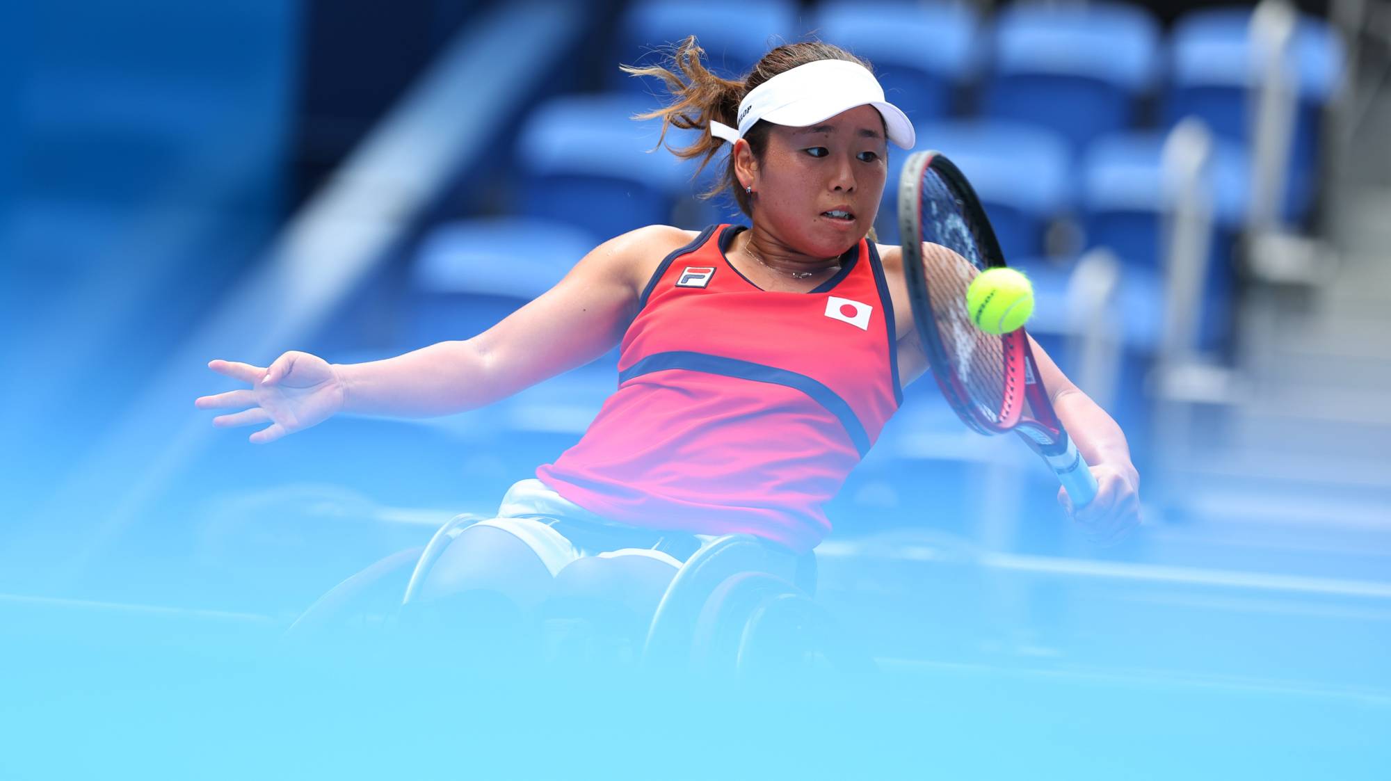 Yui Kamiji of Japan in action against Zhenzhen Zhu of China in the quarterfinal of the women's wheelchair tennis competition | REUTERS