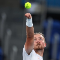 The Netherlands\' Sam Schroder in action against Japan\'s Koji Sugeno in the quad singles semifinal of wheelchair tennis. | REUTERS