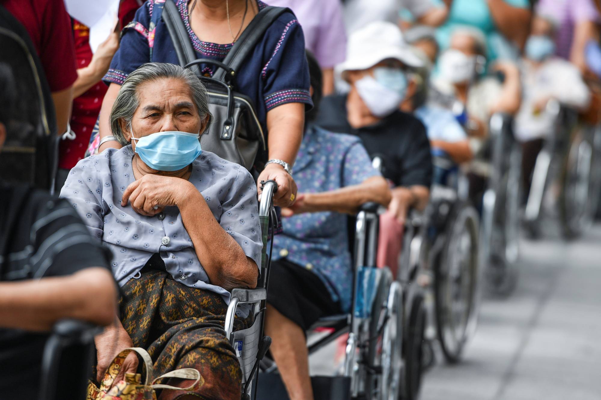 People line up to get vaccinated for COVID-19 at the Central Vaccination Center in Bangkok in July. | Reuters