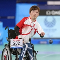 Hidetaka Sugimura (left) competes against Watcharaphon Vongsa of Thailand in the boccia mixed individual BC2 gold medal match at the Ariake Gymnastics Center in Tokyo on Wednesday.  | KYODO
