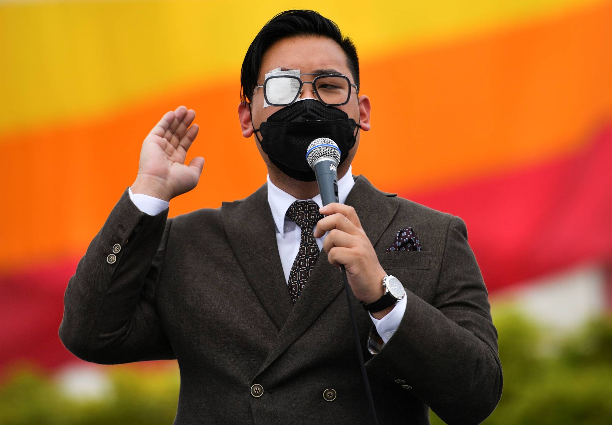 Tanat 'Nat' Thanakitamnuay speaks during a protest near the Democracy Monument in Bangkok on Aug. 28. | REUTERS 