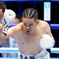 Japan\'s Kazuto Ioka throws a punch during the first round of his bout against Mexico\'s Francisco Rodriguez in Tokyo on Wednesday.  | KYODO