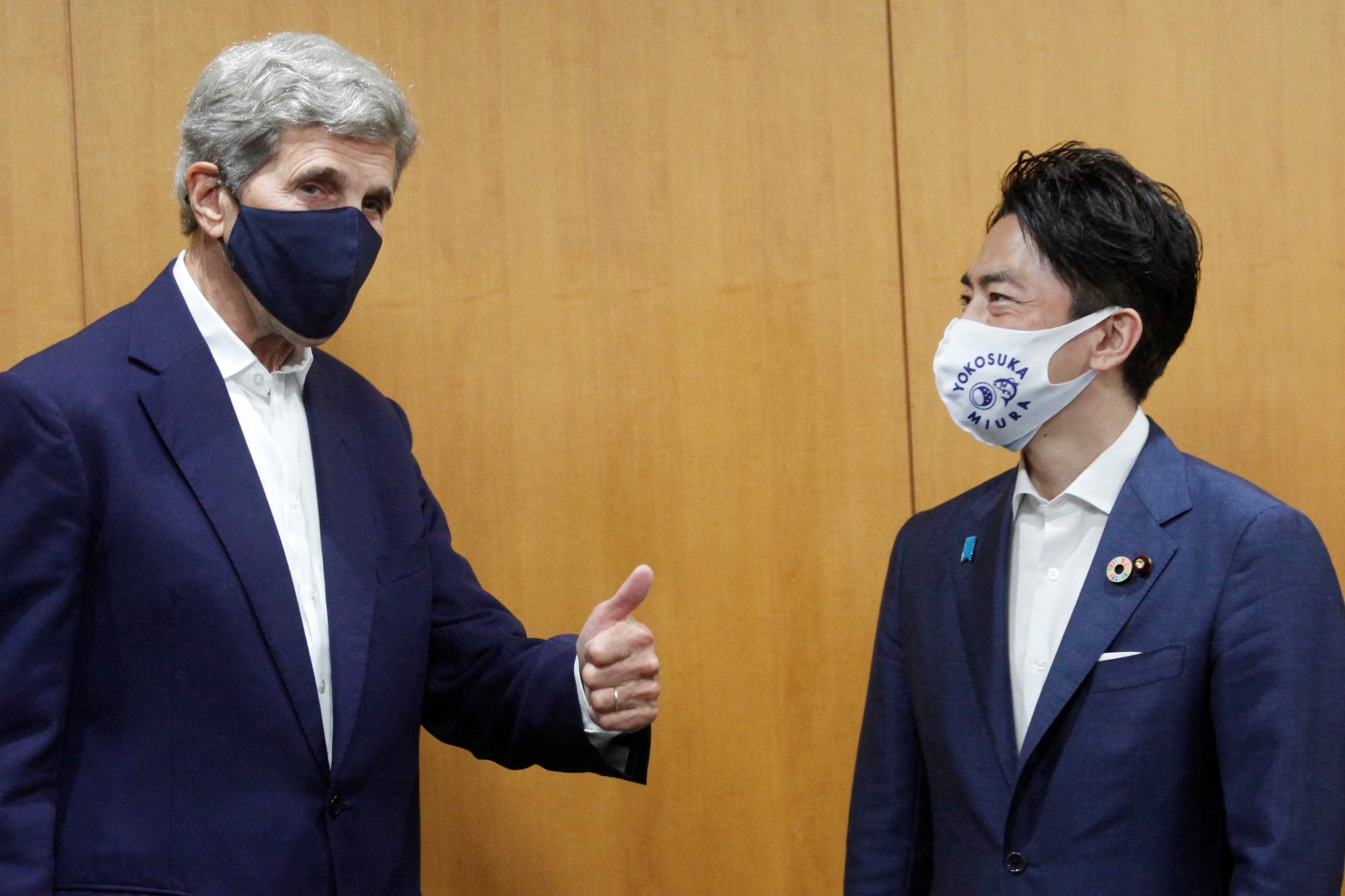 Environment Minister Shinjiro Koizumi meets U.S. climate envoy John Kerry in Tokyo on Tuesday. | Pool / via REUTERS