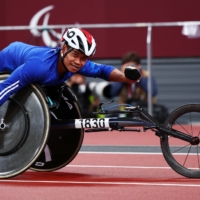 Pongsakorn Paeyo of Thailand celebrates after winning gold and setting a new Paralympic record in the men\'s T53 100 meters. | REUTERS