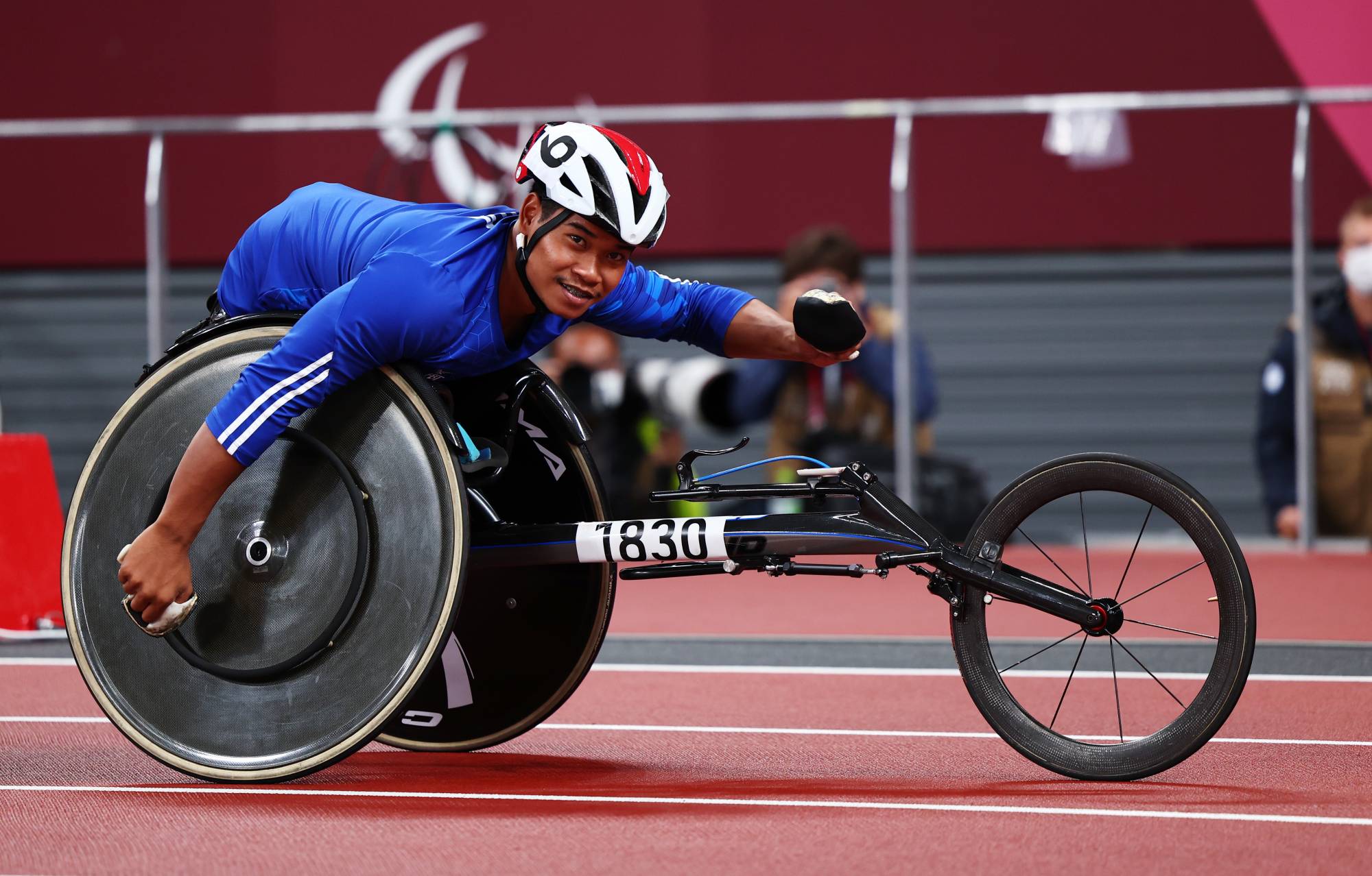Pongsakorn Paeyo of Thailand celebrates after winning gold and setting a new Paralympic record in the men's T53 100 meters. | REUTERS