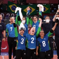 Brazil players and team officials celebrate defeating China in the women\'s goalball quarterfinal. | REUTERS