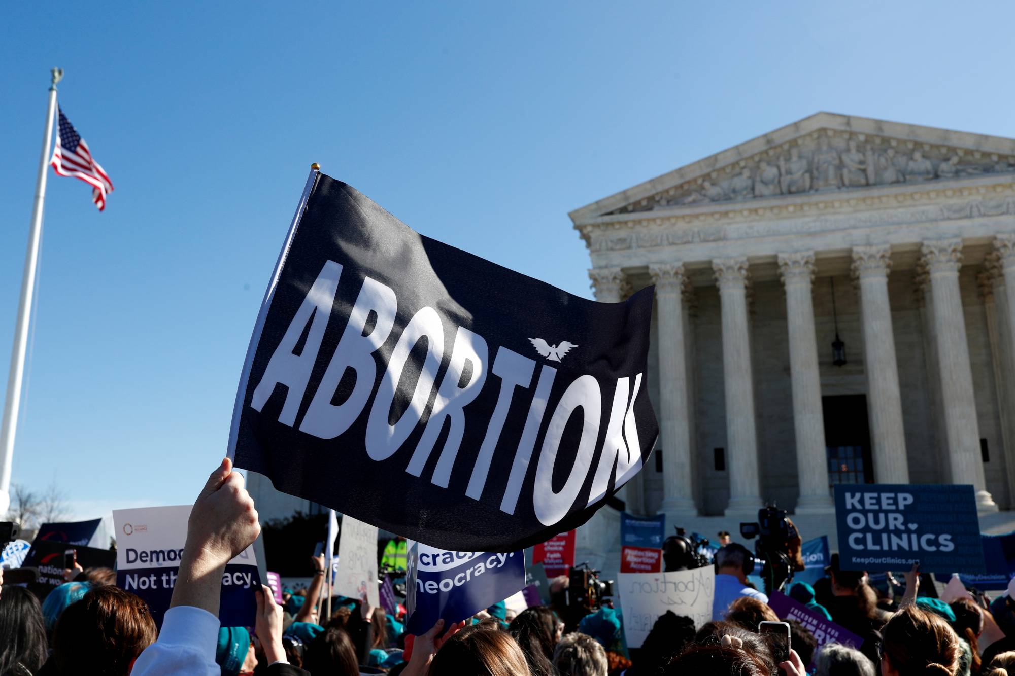 Demonstrators gather outside of the U.S. Supreme Court in Washington as justices hear a major abortion case in March.  | REUTERS 