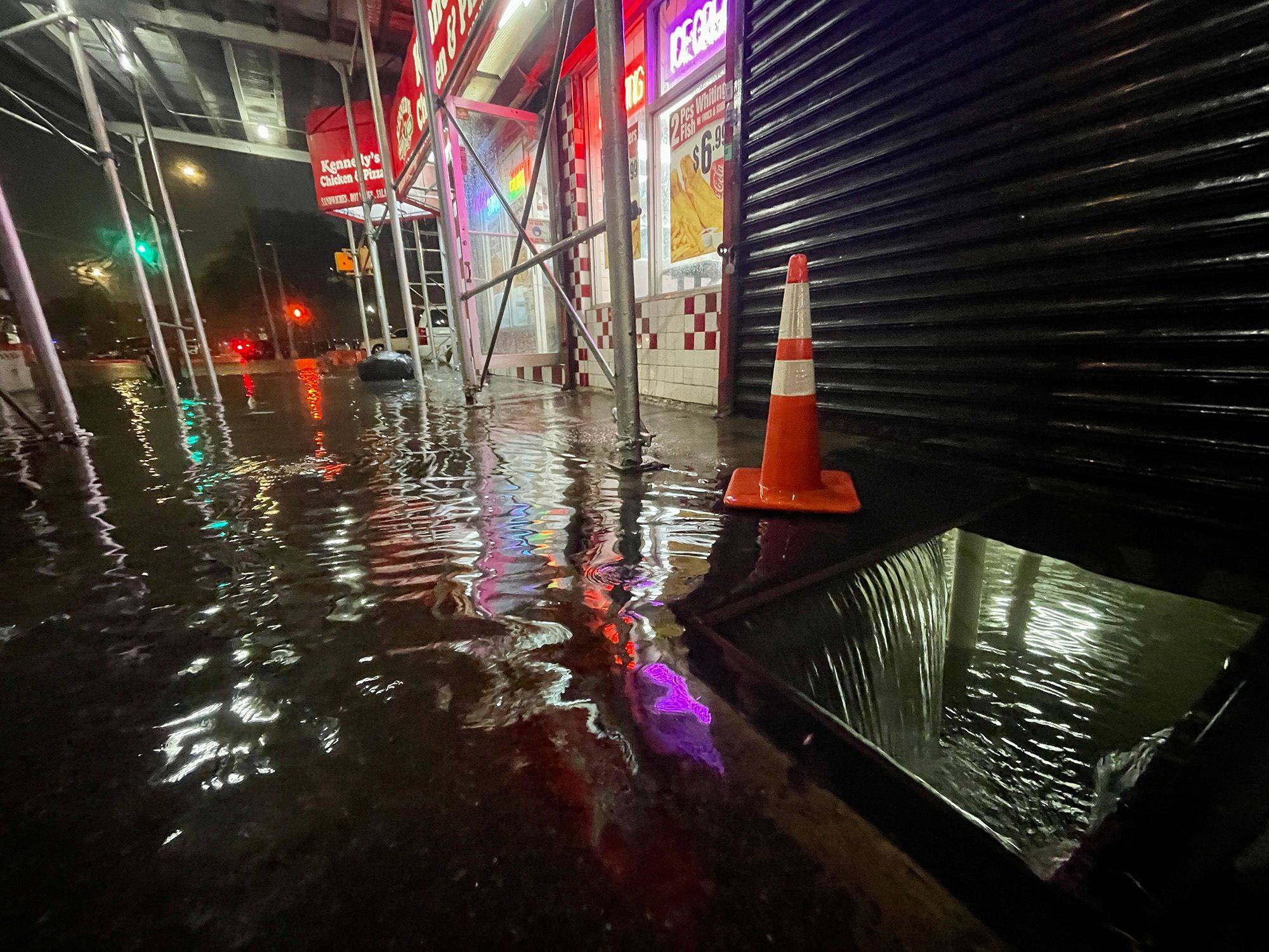 Rainfall from the remnants of Hurricane Ida floods the basement of a fast food restaurant in the Bronx, New York, on Wednesday.  | GETTY IMAGES / VIA BLOOMBERG 