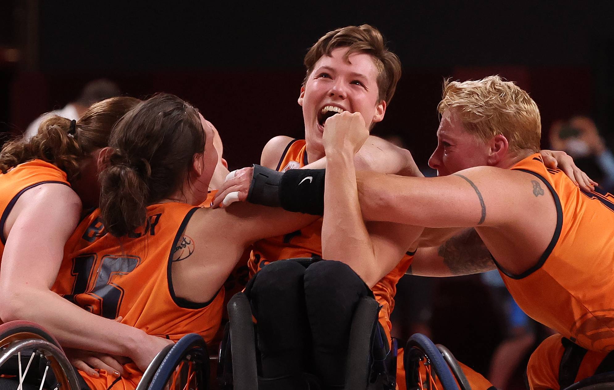 Bo Kramer of the Netherlands celebrates with her teammates their victory over Germany in the semifinal of women's wheelchair basketball. | REUTERS