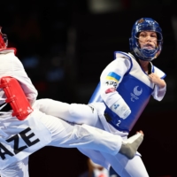 Azerbaijan\'s Royala Fataliyeva in action against Ukraine\'s Viktoriia Marchuk during the women\'s K44 -49kg repechage taekwondo | REUTERS