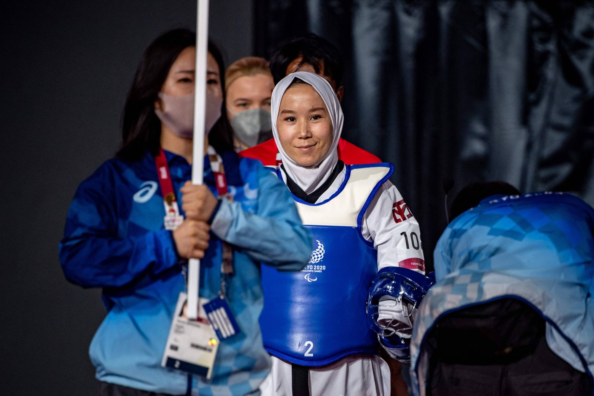 Afghanistan's Zakia Khudadadi (center) prepares to compete in the women's taekwondo K44 -49kg repechage quarter-final against Ukraine's Viktoriia Marchuk. | AFP-JIJI