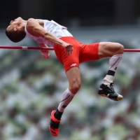 Poland\'s Maciej Lepiato in action during men\'s T64 high jump final.  | REUTERS