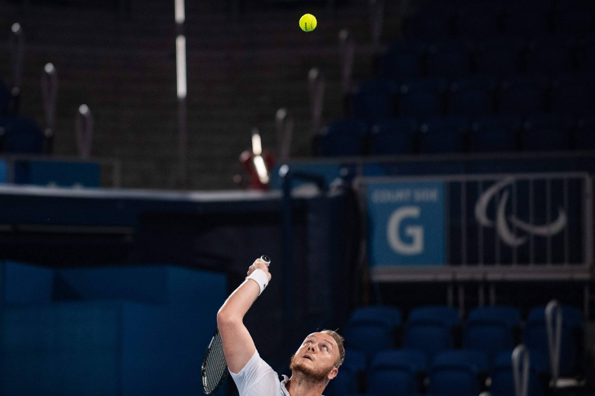France's Nicolas Peifer serves against Britain's Alfie Hewett and Gordon Reid during their men's doubles gold medal match in wheelchair tennis. | AFP-JIJI