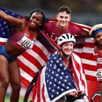 Team USA celebrates after winning the final of the 4x100m universal relay. | REUTERS
