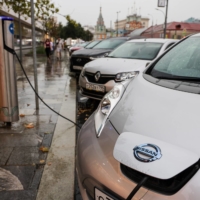 A Nissan Leaf electric vehicle is charged at a charging station in Moscow.  | BLOOMBERG