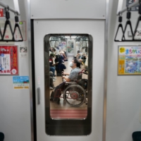 Yuto Hirano, a volunteer for the Paralympics, on the subway in Tokyo on Aug. 23. Hirano said he wished that the Paralympics could have had international spectators, who could have assessed Tokyo’s accessibility measures. | CHANG W. LEE/THE NEW YORK TIMES