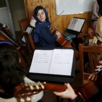 Members of the Zohra orchestra, an ensemble of 35 women, rehearse in 2016.  | REUTERS