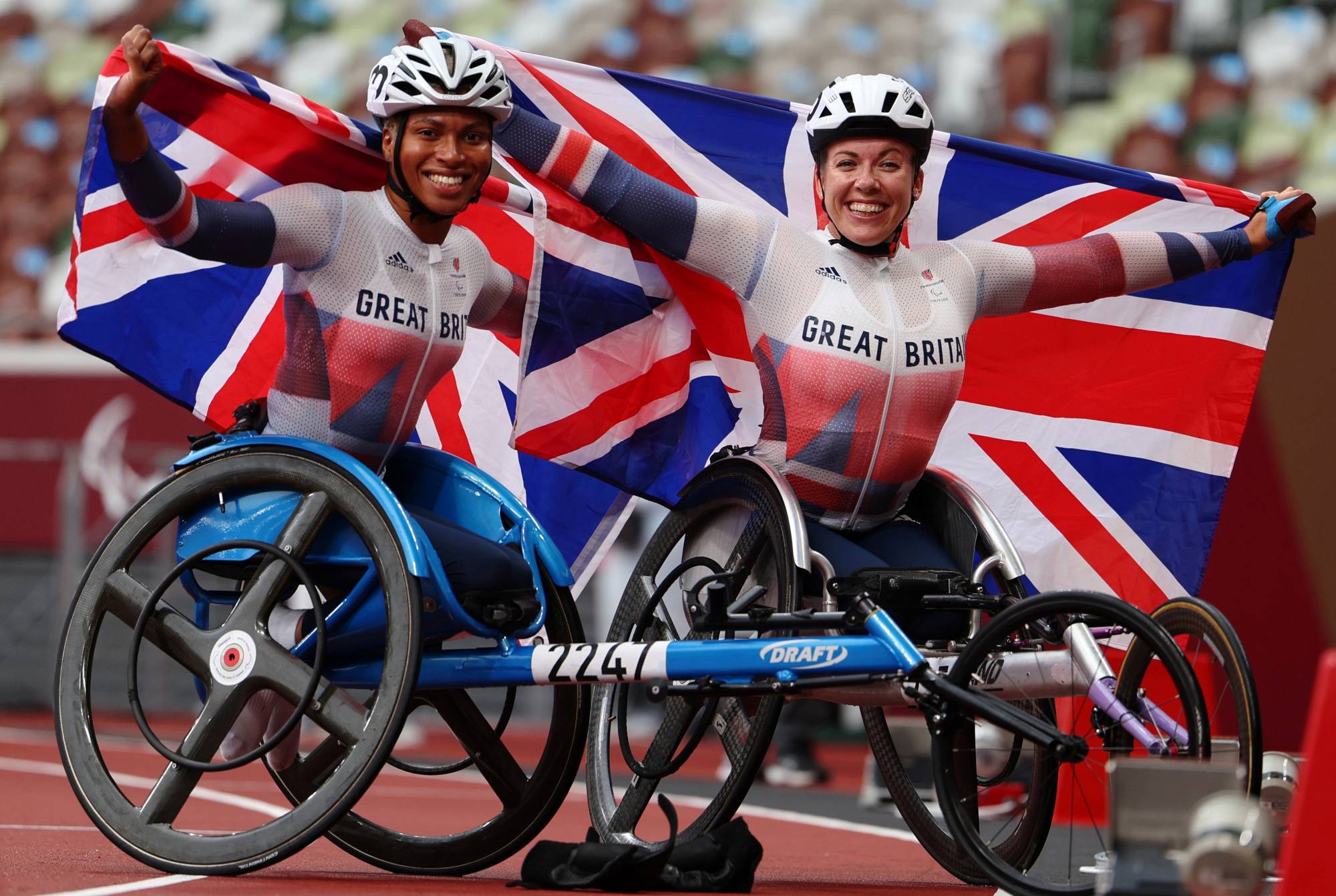 Britain's Hannah Cockroft and Kare Adenegan celebrate after winning gold and silver in the women's T34 800 meters. | REUTERS
